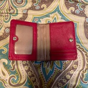 Relic billfold. Multi colored with zipper change pocket on the outside